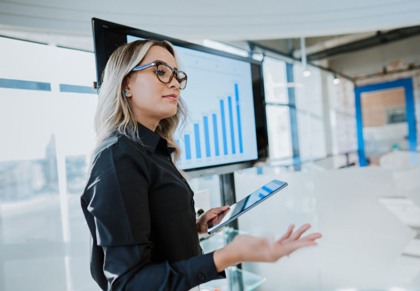 woman holding tablet in the digital workplace